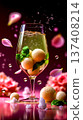 A glass of champagne with oranges and flowers in the background 137408214