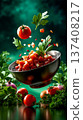A bowl of tomato salad with tomatoes and parsley falling into it 137408217