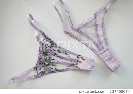glamorous stylish sexy lace lingerie. purple lacy panties isolated over white. Shopping and fashion concept. woman accessories on white background. Top view point, flat lay. High quality photo glamorous stylish sexy lace lingerie. purple lacy panties isolated over white. Shopping and fashion concept. woman accessories on white background. Top view point, flat lay. High quality photo 137408674