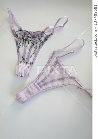 glamorous stylish sexy lace lingerie. purple lacy panties isolated over white. Shopping and fashion concept. woman accessories on white background. Top view point, flat lay. High quality photo glamorous stylish sexy lace lingerie. purple lacy panties isolated over white. Shopping and fashion concept. woman accessories on white background. Top view point, flat lay. High quality photo 137408681