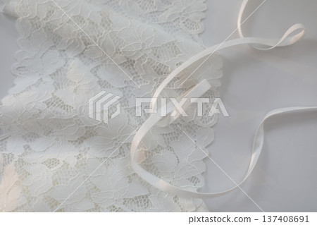 delicate silk lace, Beautiful guipure fabric, ribbon tapes on white background. lace fabric. soft, elegant, high quality lace fabric, delicate silk lace, Beautiful guipure fabric, ribbon tapes on white background. lace fabric. soft, elegant, high quality lace fabric, 137408691