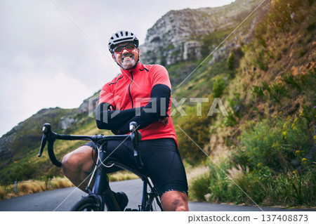 Portrait, cycling and arms crossed with man in nature for sports, training and challenge. Exercise, workout and health with mature person on bike in mountains for energy, freedom and performance Portrait, cycling and arms crossed with man in nature for sports, training and challenge. Exercise, workout and health with mature person on bike in mountains for energy, freedom and performance 137408873