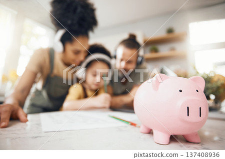 Piggy bank, table and parents with child, learning and writing with headphones, paper and saving advice. Mom, dad and kid for education, investing and helping for future in interracial family house Piggy bank, table and parents with child, learning and writing with headphones, paper and saving advice. Mom, dad and kid for education, investing and helping for future in interracial family house 137408936