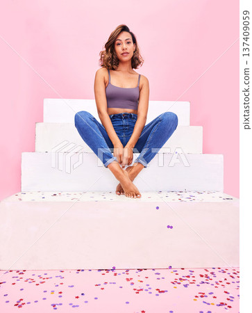 Portrait, steps and woman with confetti, style and fashion with celebration on a pink studio background. Person, gen z or girl with sparkle, party or event with confident model or birthday decoration Portrait, steps and woman with confetti, style and fashion with celebration on a pink studio background. Person, gen z or girl with sparkle, party or event with confident model or birthday decoration 137409059