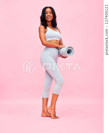 Yoga mat, woman and smile of portrait in studio for healthy body, exercise or fitness on pink background. Happy sports model in pilates training, workout and confident for power, energy and self care Yoga mat, woman and smile of portrait in studio for healthy body, exercise or fitness on pink background. Happy sports model in pilates training, workout and confident for power, energy and self care 137409121