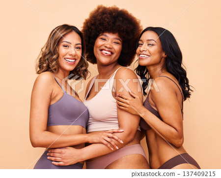Diversity, natural beauty and portrait of happy women with smile, self love or body positivity in studio. Happy face, group of people on beige background in underwear, skincare inclusion in cosmetics Diversity, natural beauty and portrait of happy women with smile, self love or body positivity in studio. Happy face, group of people on beige background in underwear, skincare inclusion in cosmetics 137409215
