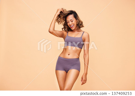 Healthy body, dance and happy woman in lingerie in studio with self love, results and skincare on wall background. Beauty, cosmetics and female model dancing for wellness, good mood or acceptance Healthy body, dance and happy woman in lingerie in studio with self love, results and skincare on wall background. Beauty, cosmetics and female model dancing for wellness, good mood or acceptance 137409253