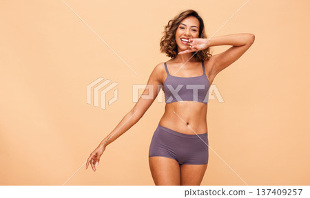 Happy portrait, lingerie and body of woman in studio isolated on brown background mockup space. Smile, underwear and model in natural beauty, self love or confidence in positivity, health or wellness Happy portrait, lingerie and body of woman in studio isolated on brown background mockup space. Smile, underwear and model in natural beauty, self love or confidence in positivity, health or wellness 137409257