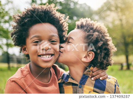 Portrait, kids and boy siblings kiss in a park for play, fun and bonding in nature together. Family, face and brothers hug, African children and happy outdoor with love, support and trust on weekend 137409287