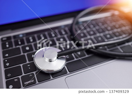 Computer, stethoscope and online for medical advice, professional, or expert in healthcare, cardiology and care. Contact us, laptop and pc keyboard to search for nurse, doctor or health specialist 137409329