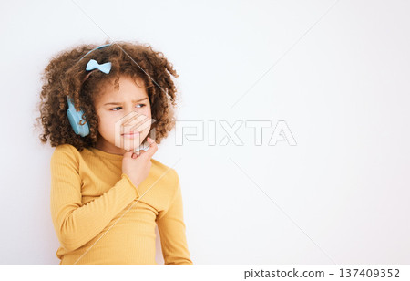 Thinking, problem and child with headphones on white background for planning, solution or music. Mockup, stress and a girl kid with a podcast, radio or audio idea with space for listening information Thinking, problem and child with headphones on white background for planning, solution or music. Mockup, stress and a girl kid with a podcast, radio or audio idea with space for listening information 137409352