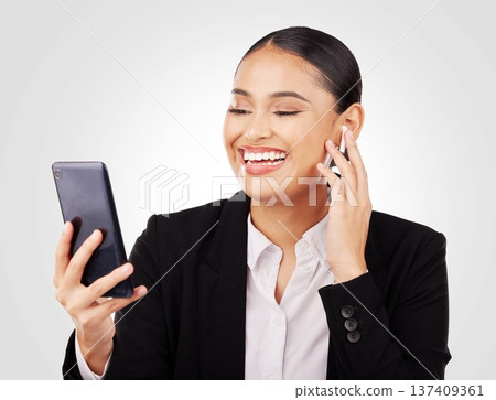 Smile, phone and earphones with a business woman in studio on a white background for communication. Smile, networking and video call with a happy young employee in a virtual meeting on her mobile Smile, phone and earphones with a business woman in studio on a white background for communication. Smile, networking and video call with a happy young employee in a virtual meeting on her mobile 137409361