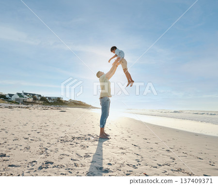 Father throwing child in air on beach, sunshine and playing together in summer on tropical island holiday. Fun, dad and boy on happy ocean vacation with love, support and relax in blue sky in Hawaii. Father throwing child in air on beach, sunshine and playing together in summer on tropical island holiday. Fun, dad and boy on happy ocean vacation with love, support and relax in blue sky in Hawaii. 137409371