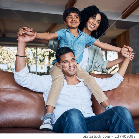 Smile, airplane and relax with family on sofa for happy, bonding or peace on holiday. Love, care and playful with parents and child in living room at home for vacation, hug and fun together Smile, airplane and relax with family on sofa for happy, bonding or peace on holiday. Love, care and playful with parents and child in living room at home for vacation, hug and fun together 137409392