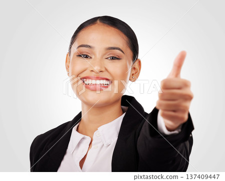 Happy business woman, portrait and thumbs up in success, winning or thank you against a studio background. Female person or employee smile with like emoji, yes sign or OK in agreement or approval Happy business woman, portrait and thumbs up in success, winning or thank you against a studio background. Female person or employee smile with like emoji, yes sign or OK in agreement or approval 137409447