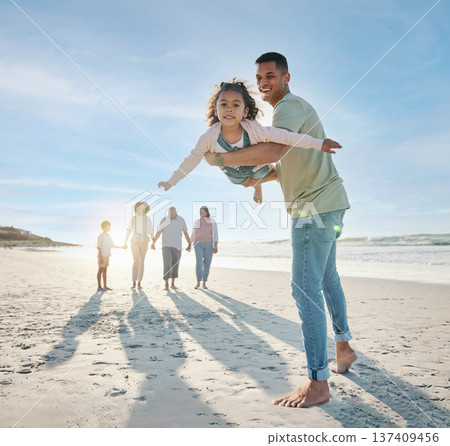Dad, girl and family at beach, airplane game and portrait with smile, bonding and love in summer sunshine on vacation. People, father and flying daughter, happy and swinging in air, ocean and holiday Dad, girl and family at beach, airplane game and portrait with smile, bonding and love in summer sunshine on vacation. People, father and flying daughter, happy and swinging in air, ocean and holiday 137409456