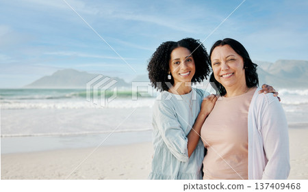 Portrait, hug and woman with mother at a beach happy, bond and relax in nature together. Love, smile and lady face with mom the ocean for freedom, travel and adventure trip at the sea in South Africa 137409468