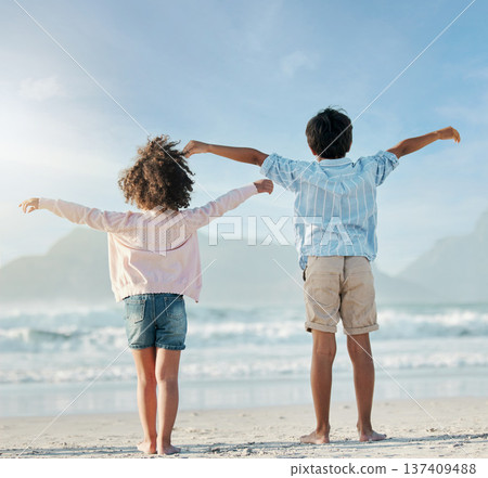 Kids, playing and airplane on beach, vacation or freedom on holiday in summer in Brazil with ocean, blue sky and happiness. Girl, boy and children play game as plane to fly for fun, bonding together Kids, playing and airplane on beach, vacation or freedom on holiday in summer in Brazil with ocean, blue sky and happiness. Girl, boy and children play game as plane to fly for fun, bonding together 137409488