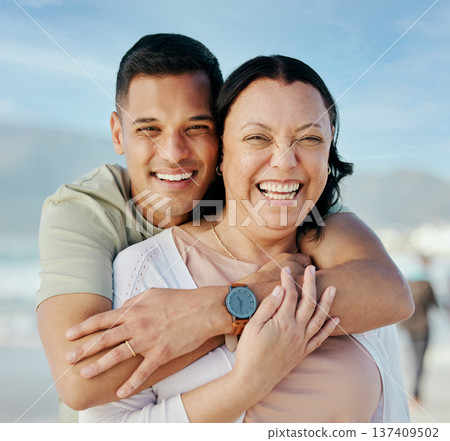 Portrait, hug and man with mother at beach happy, bond and relax in nature together. Love, smile and male face with mom the ocean for freedom, travel and adventure, trip or family holiday in Bahamas Portrait, hug and man with mother at beach happy, bond and relax in nature together. Love, smile and male face with mom the ocean for freedom, travel and adventure, trip or family holiday in Bahamas 137409502