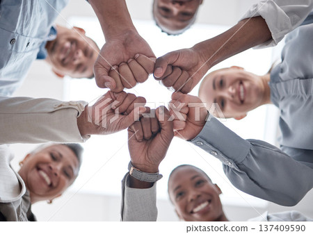 Hands fist bump, group circle and business people celebrate community support, synergy or happy corporate achievement. Below view, trust and staff commitment, solidarity and team building motivation Hands fist bump, group circle and business people celebrate community support, synergy or happy corporate achievement. Below view, trust and staff commitment, solidarity and team building motivation 137409590