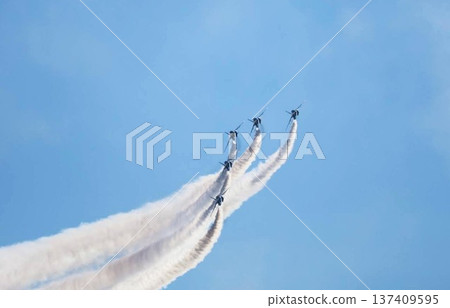 The Japan Self-Defense Force's Blue Impulse flies through the blue sky, emitting smoke. The Japan Self-Defense Force's Blue Impulse flies through the blue sky, emitting smoke. 137409595