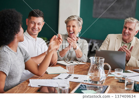 Business people, celebrate and clapping for success in a meeting with pride and teamwork. Happy corporate men and women group applause in office for company growth, achievement or win with diversity 137409634