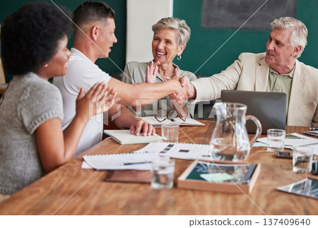 Applause, promotion and bonus with business people shaking hands in an office during a meeting. Success, motivation and handshake for support, partnership or thank you in the company boardroom 137409640