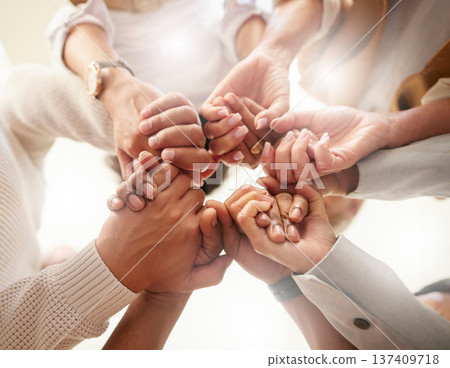 Office, teamwork and holding hands in circle for team building, trust and motivation at startup company. Work, goals and diversity in group of business people with growth, helping hand and support. Office, teamwork and holding hands in circle for team building, trust and motivation at startup company. Work, goals and diversity in group of business people with growth, helping hand and support. 137409718