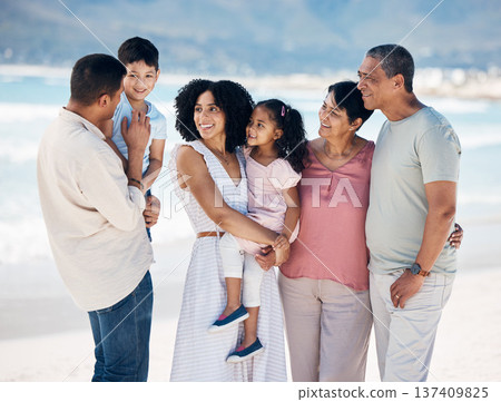 Grandparents, kids and parents at beach, big family or talk with smile, care or bonding on vacation. Mother, father and senior people with children, chat or love in summer sunshine for holiday by sea Grandparents, kids and parents at beach, big family or talk with smile, care or bonding on vacation. Mother, father and senior people with children, chat or love in summer sunshine for holiday by sea 137409825
