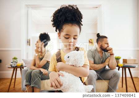 Divorce, fight and sad boy child with teddy bear in a living room for stress, support and comfort at home. Family, crisis and kid with anxiety for toxic parents, argue or dispute, depression or fear 137409841