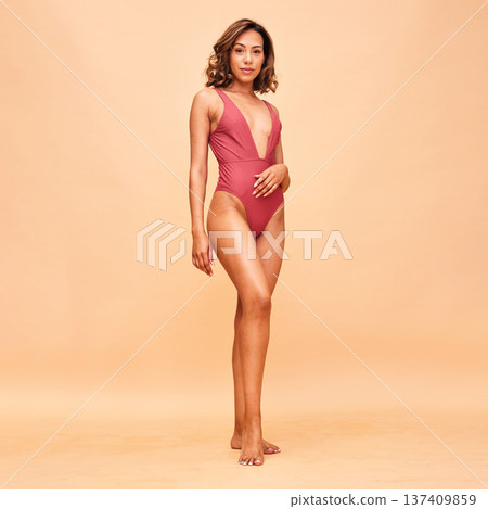Beauty, summer and swimsuit with portrait of woman in studio for fashion, tropical and wellness. Beach, vacation and body with person on beige background for confident, holiday and self love mockup Beauty, summer and swimsuit with portrait of woman in studio for fashion, tropical and wellness. Beach, vacation and body with person on beige background for confident, holiday and self love mockup 137409859