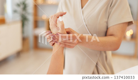 Relax, massage and hands of woman in spa for luxury treatment, skincare and wellness with masseuse. Resort salon, beauty and person do manicure for healthy skin, grooming and holistic stress relief Relax, massage and hands of woman in spa for luxury treatment, skincare and wellness with masseuse. Resort salon, beauty and person do manicure for healthy skin, grooming and holistic stress relief 137410033