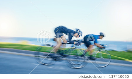 Motion blur, competition and cyclist on bicycle on road in nature with helmet, exercise adventure and speed. Cycling race, challenge and men with bike for fast workout, training motivation or energy. Motion blur, competition and cyclist on bicycle on road in nature with helmet, exercise adventure and speed. Cycling race, challenge and men with bike for fast workout, training motivation or energy. 137410060