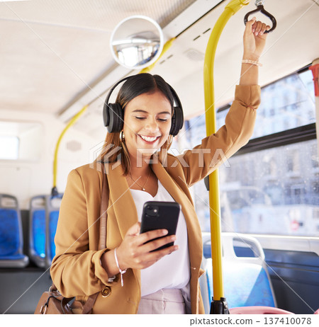 Bus, woman and phone headphones with public transport, social media scroll and smile with commute. Travel, music and internet app of a female professional on a mobile with networking on metro Bus, woman and phone headphones with public transport, social media scroll and smile with commute. Travel, music and internet app of a female professional on a mobile with networking on metro 137410078