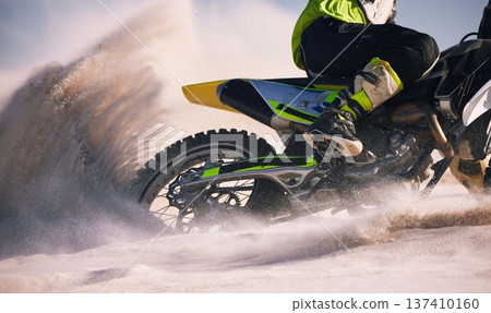 Sand, desert and person on motorbike in action for race training, workout and speed challenge in sports. Extreme transport, travel and cyclist with motorcycle for adventure, freedom and adrenaline 137410160
