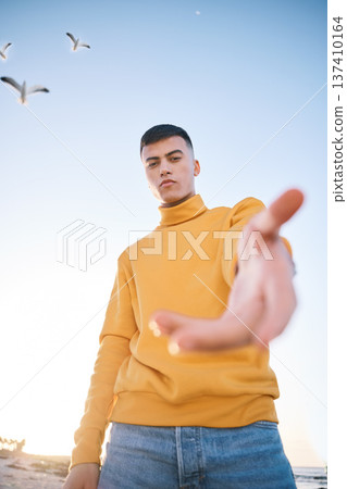 Man, hand and beach portrait for follow sign, choice and call for vacation, outdoor and adventure in nature. Gen z guy, student and open palm for decision, holiday and recruitment by ocean in summer Man, hand and beach portrait for follow sign, choice and call for vacation, outdoor and adventure in nature. Gen z guy, student and open palm for decision, holiday and recruitment by ocean in summer 137410164
