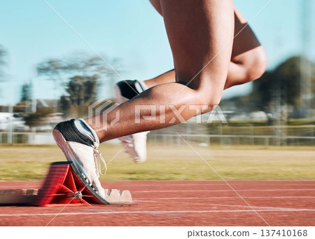 Start, running and speed with shoes of person on race track for fitness, sports and marathon training. Competition, health and workout with closeup of runner in stadium for energy and performance 137410168