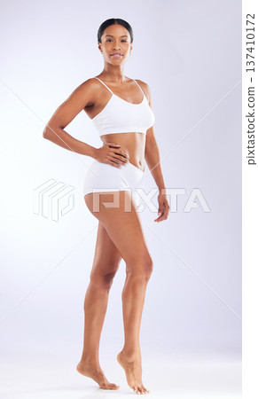 Body, portrait and a woman in underwear on a white background for skincare, grooming or wellness. Clean, health and a girl or model in clothes for beauty or dermatology glow on a studio backdrop Body, portrait and a woman in underwear on a white background for skincare, grooming or wellness. Clean, health and a girl or model in clothes for beauty or dermatology glow on a studio backdrop 137410172