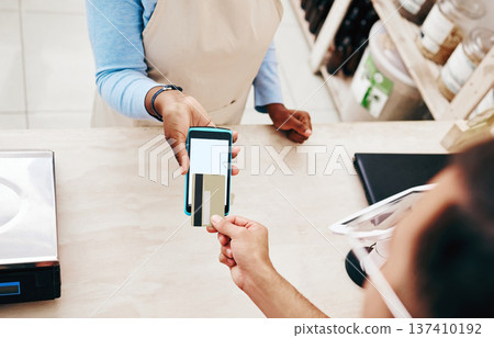 Credit card, store payment and above hand with cashier, machine and transaction in a retail shop. People, ecommerce and shopping with electronic pay, fintech and customer with purchase and tech 137410192