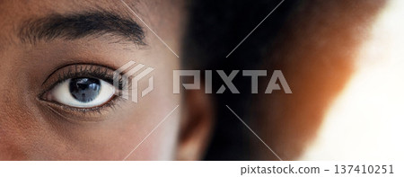 Eyes, closeup and portrait of African woman with mockup space for focus, thinking and vision. Banner, lens flare and zoom of half face of person looking for perception, awareness and intense stare Eyes, closeup and portrait of African woman with mockup space for focus, thinking and vision. Banner, lens flare and zoom of half face of person looking for perception, awareness and intense stare 137410251