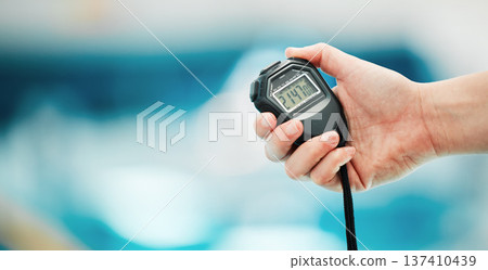 Hand, stopwatch and mockup with a fitness coach closeup in a sports center for time or training. Clock, exercise and cardio or endurance with a personal trainer for marathon motivation or challenge Hand, stopwatch and mockup with a fitness coach closeup in a sports center for time or training. Clock, exercise and cardio or endurance with a personal trainer for marathon motivation or challenge 137410439