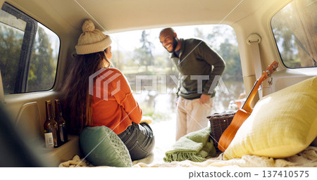 Winter and a couple in a car for a road trip, date or watching the view together. Happy, travel and back of a man and woman with an affection in transport during a holiday or camping in nature Winter and a couple in a car for a road trip, date or watching the view together. Happy, travel and back of a man and woman with an affection in transport during a holiday or camping in nature 137410575