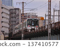 JR commuter train running on a railway bridge and Hiroshima cityscape 137410577