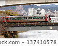 JR Red Wing train running through Hiroshima city and cityscape 137410578