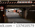 An underpass road with a height limit of 3.7m and a "Watch out for the beams" sign 137410579