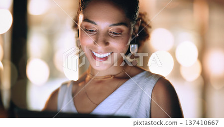 Screen, office and face of black woman at night working online, reading internet website and do research. Business, technology and female worker networking on tablet, computer or laptop in workplace Screen, office and face of black woman at night working online, reading internet website and do research. Business, technology and female worker networking on tablet, computer or laptop in workplace 137410667