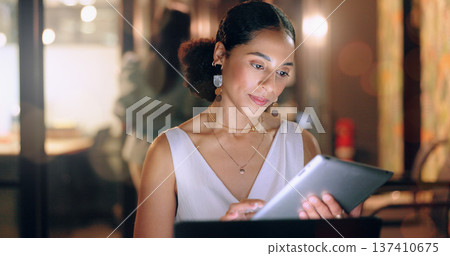 Night office, tablet and business woman typing email, report or sales proposal. Overtime, technology or black female employee with touchscreen busy working late on marketing project in dark workplace Night office, tablet and business woman typing email, report or sales proposal. Overtime, technology or black female employee with touchscreen busy working late on marketing project in dark workplace 137410675
