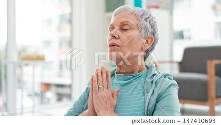 Yoga, namaste meditation and woman breathing for mindfulness, senior exercise or healing at home. Face of healthy old lady, breathe and meditate with prayer hands for zen, wellness and focus on peace Yoga, namaste meditation and woman breathing for mindfulness, senior exercise or healing at home. Face of healthy old lady, breathe and meditate with prayer hands for zen, wellness and focus on peace 137410693