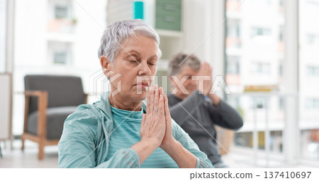 Senior people, yoga class and coach meditation, prayer and peace hands for exercise, holistic wellness and mindfulness. Spiritual workout, group and calm elderly women, clients and personal trainer 137410697