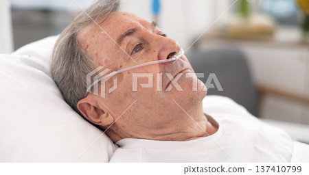 Oxygen, hospital bed and senior man with ventilation and breathing tube support in a clinic. Elderly patient, medical care and emergency room with male person at a doctor for wellness and healthcare Oxygen, hospital bed and senior man with ventilation and breathing tube support in a clinic. Elderly patient, medical care and emergency room with male person at a doctor for wellness and healthcare 137410799